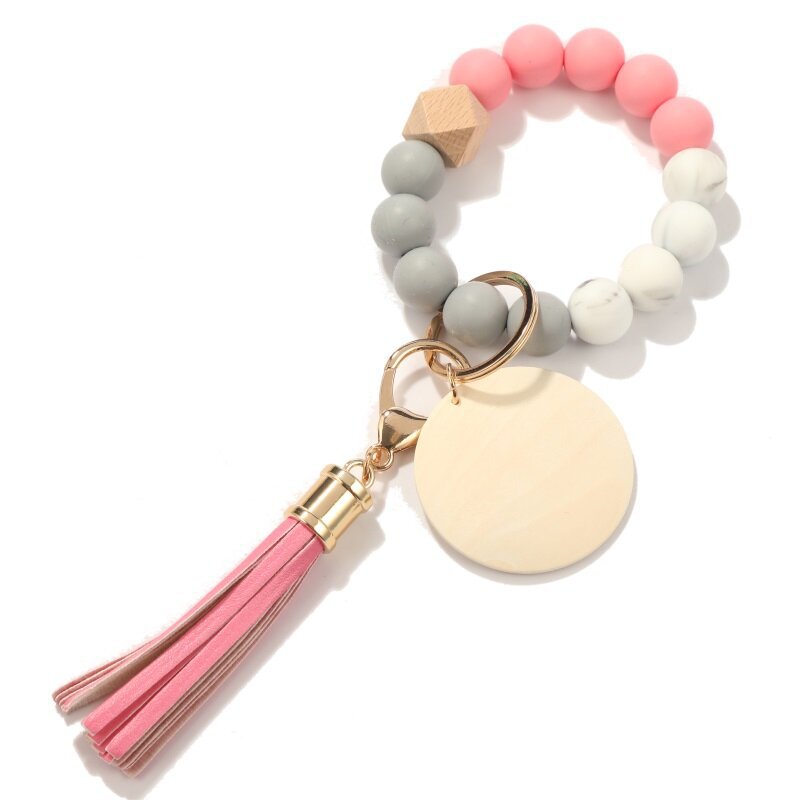 Llavero de muñeca con cuentas de silicona con flecos de marca de madera en blanco al por mayor